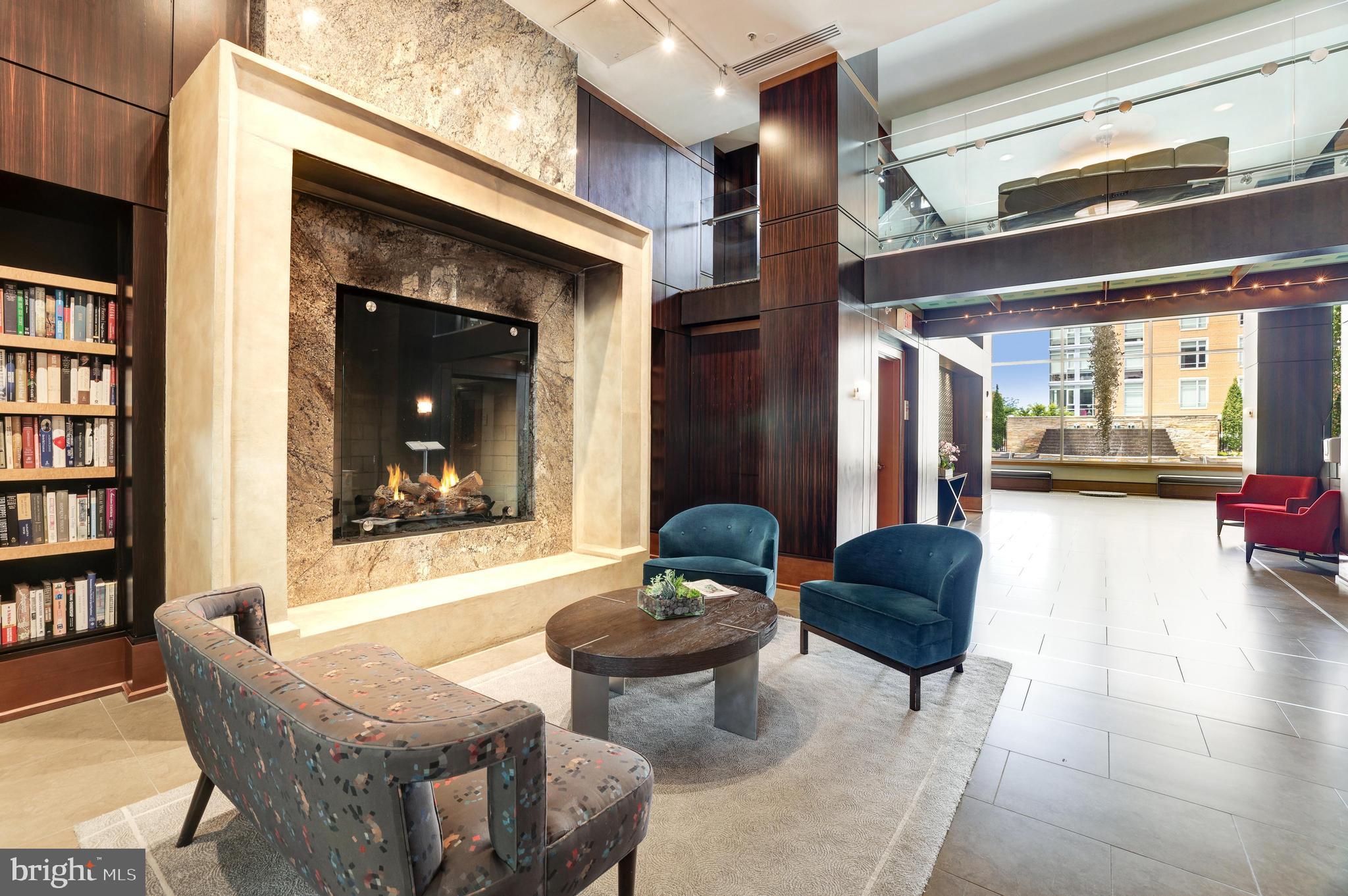 11990 Market Street, Unit 1414 Reston, VA 20190 - Photo 65 of 65 a living room with furniture and a fireplace