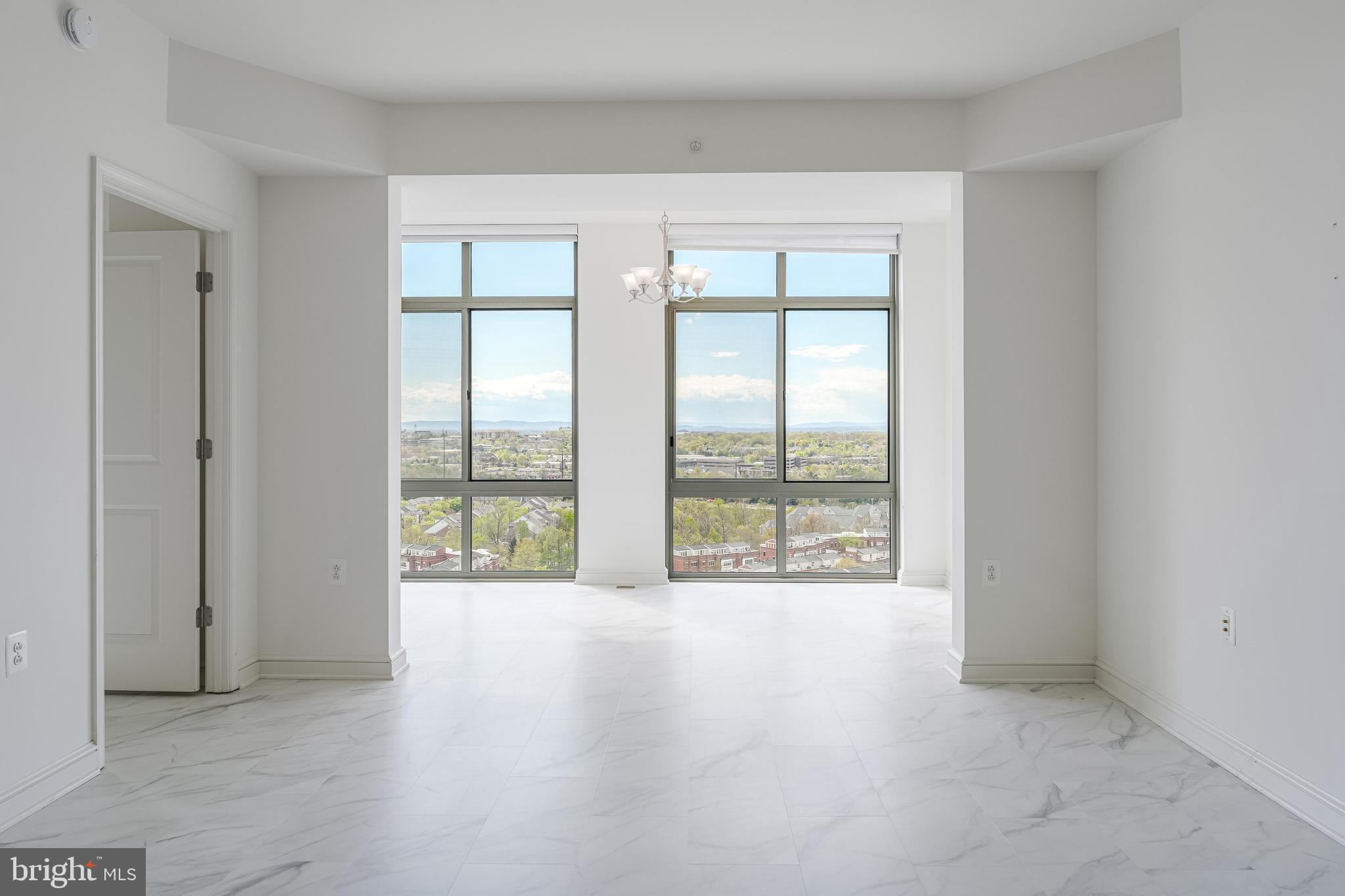 11990 Market Street, Unit 1414 Reston, VA 20190 - Photo 9 of 65 a view of an empty room with a window