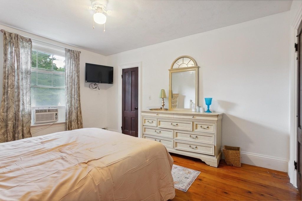 7 Spring Street Spencer, MA 01562 - Photo 17 of 38 a bedroom with a bed and a television