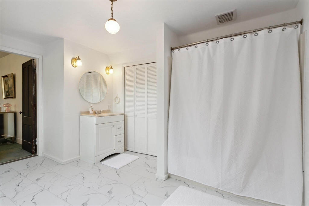 7 Spring Street Spencer, MA 01562 - Photo 25 of 38 a view of a bathroom with sink and mirror