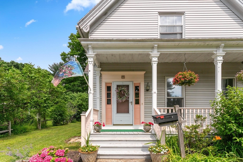 7 Spring Street Spencer, MA 01562 - Photo 27 of 38 a front view of a house with garden