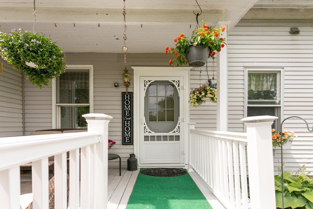 7 Spring Street Spencer, MA 01562 - Photo 29 of 38 a front view of a house with a porch