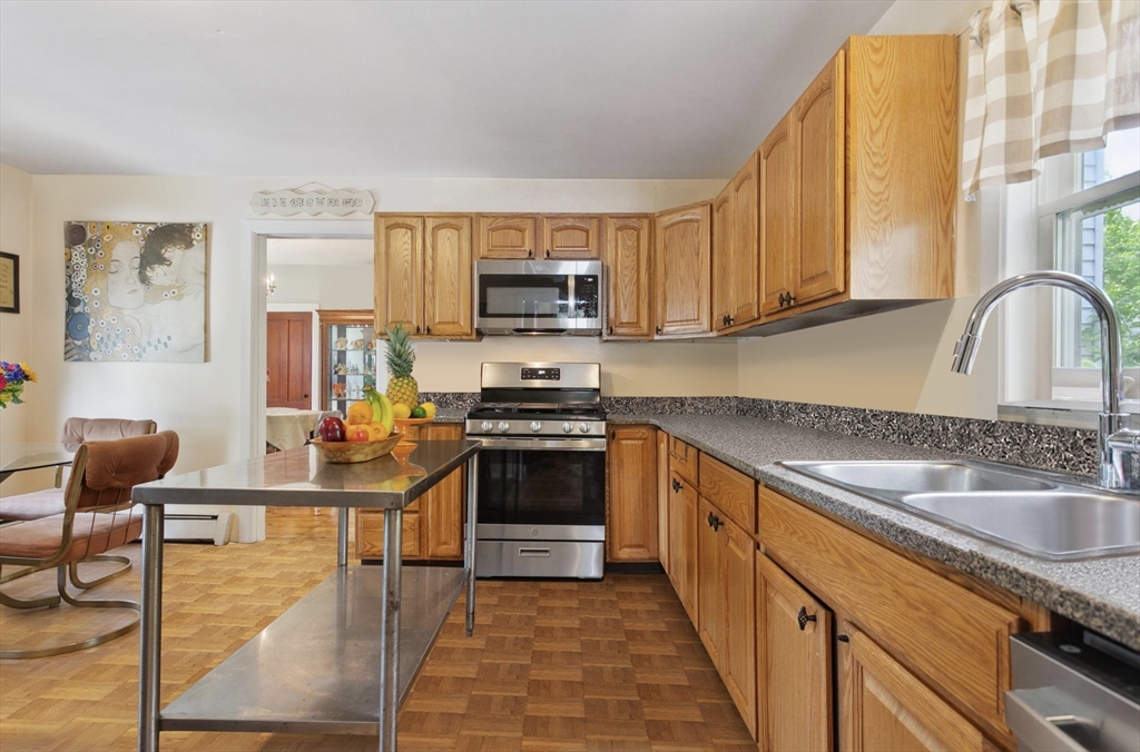 7 Spring Street Spencer, MA 01562 - Photo 3 of 38 a kitchen with stainless steel appliances granite countertop a stove a sink and a microwave