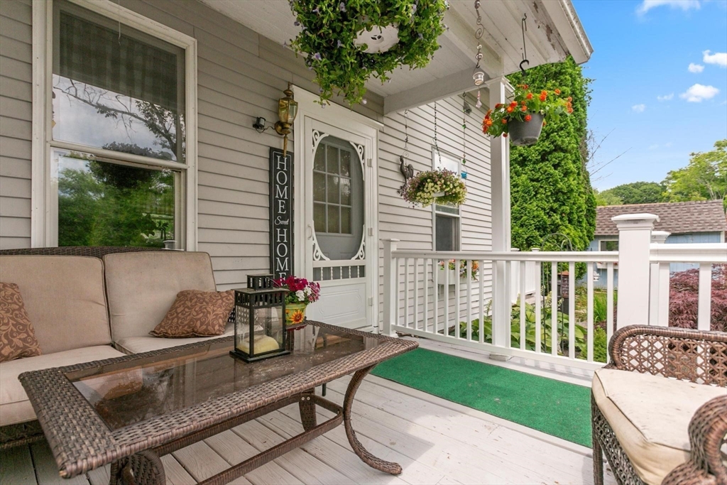 7 Spring Street Spencer, MA 01562 - Photo 31 of 38 a view of a patio with a table and chairs