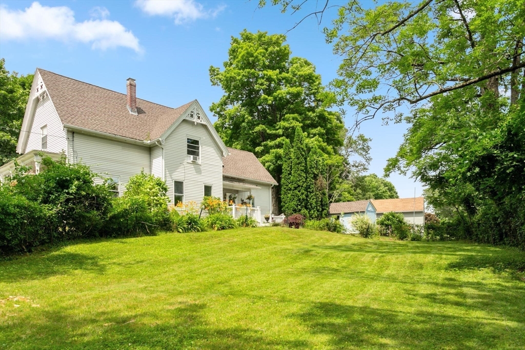 7 Spring Street Spencer, MA 01562 - Photo 33 of 38 a front view of house with yard and green space
