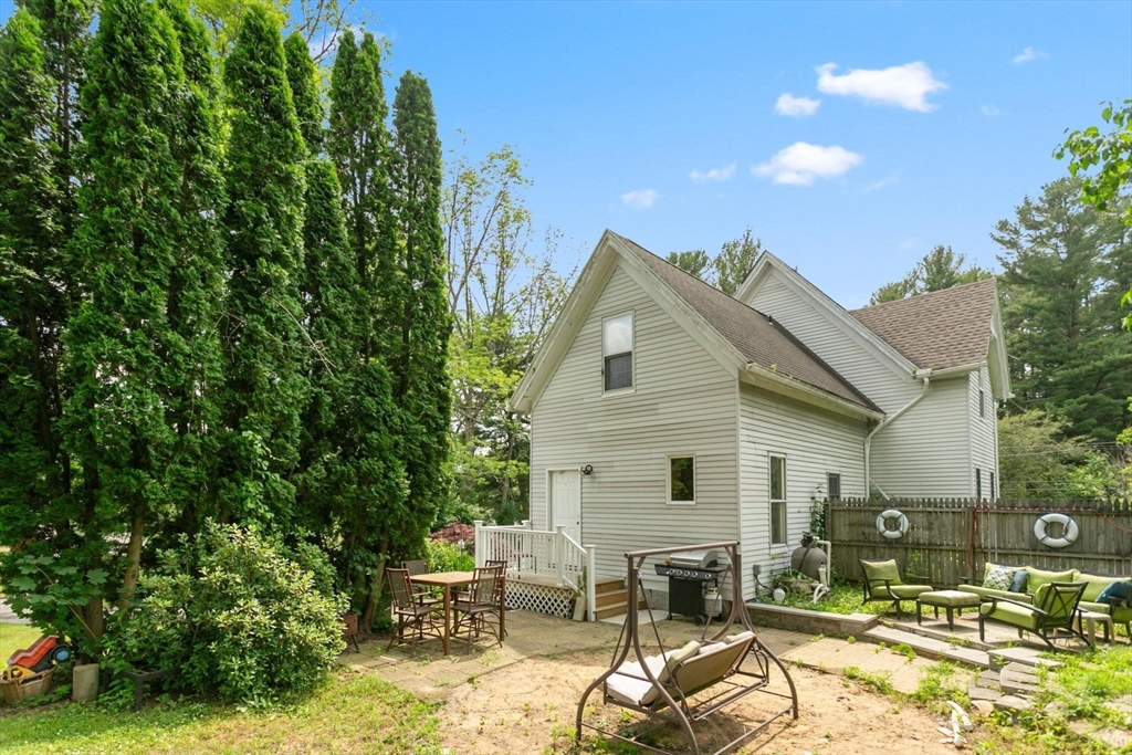 7 Spring Street Spencer, MA 01562 - Photo 35 of 38 a view of a patio with table and chairs and potted plants