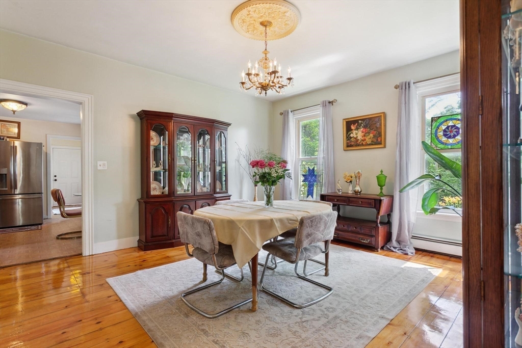 7 Spring Street Spencer, MA 01562 - Photo 7 of 38 a view of a dining room with furniture wooden floor and chandelier