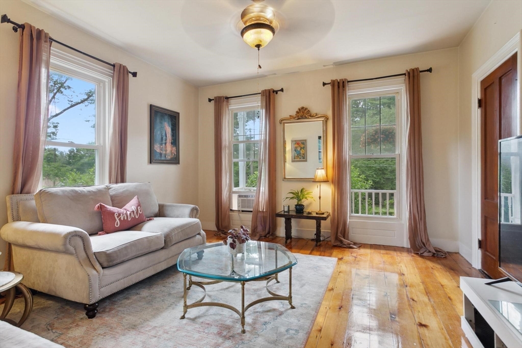 7 Spring Street Spencer, MA 01562 - Photo 10 of 38 a living room with furniture and a window