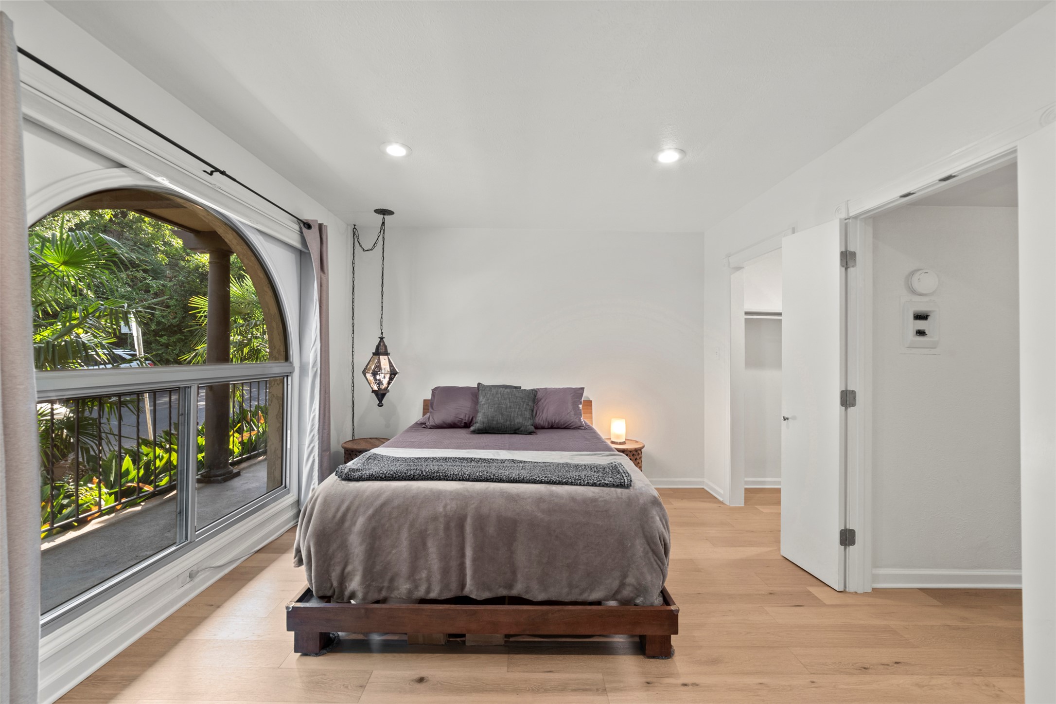 505 West 7th Street, Unit 113 Austin, TX 78701 - Photo 16 of 26 a bedroom with a bed and a large window