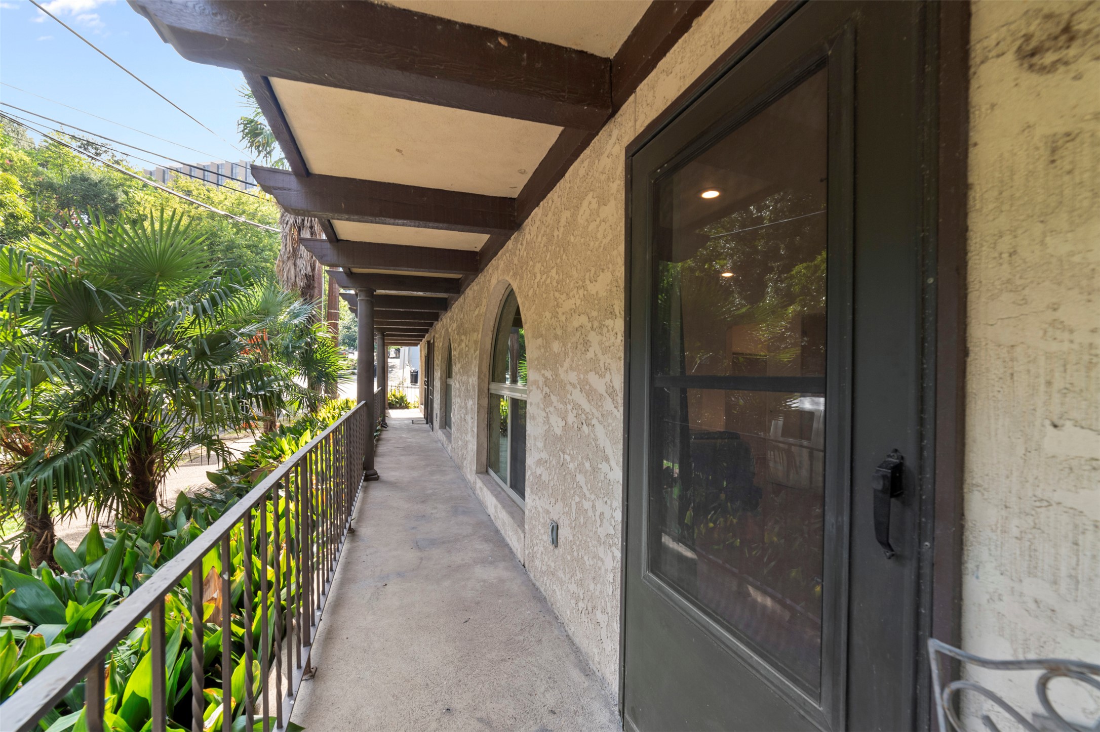 505 West 7th Street, Unit 113 Austin, TX 78701 - Photo 20 of 26 a stairs and an trees in the balcony