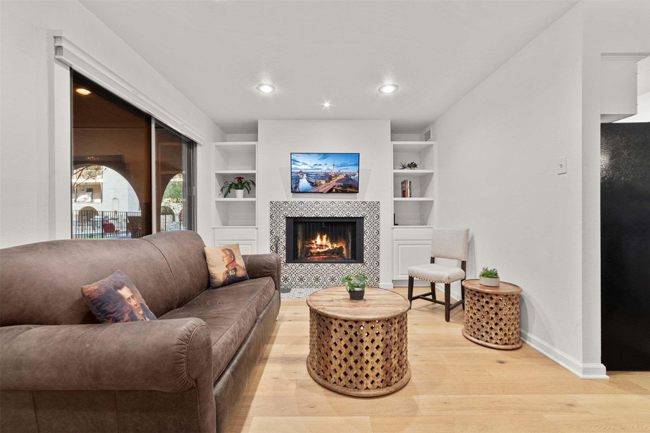 505 West 7th Street, Unit 113 Austin, TX 78701 - Photo 2 of 26 a living room with furniture and a fireplace