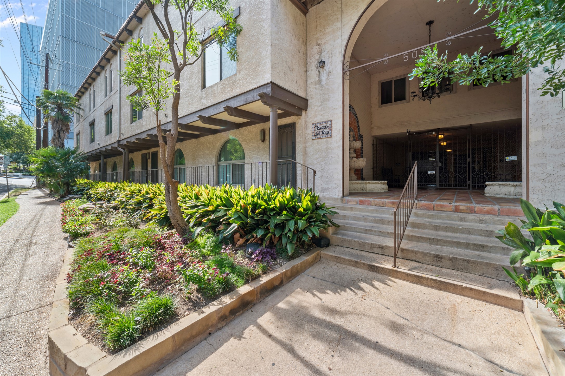 505 West 7th Street, Unit 113 Austin, TX 78701 - Photo 3 of 26 a view of a garden with pathway