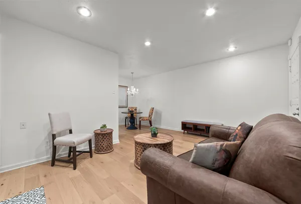 a living room with furniture and a rug