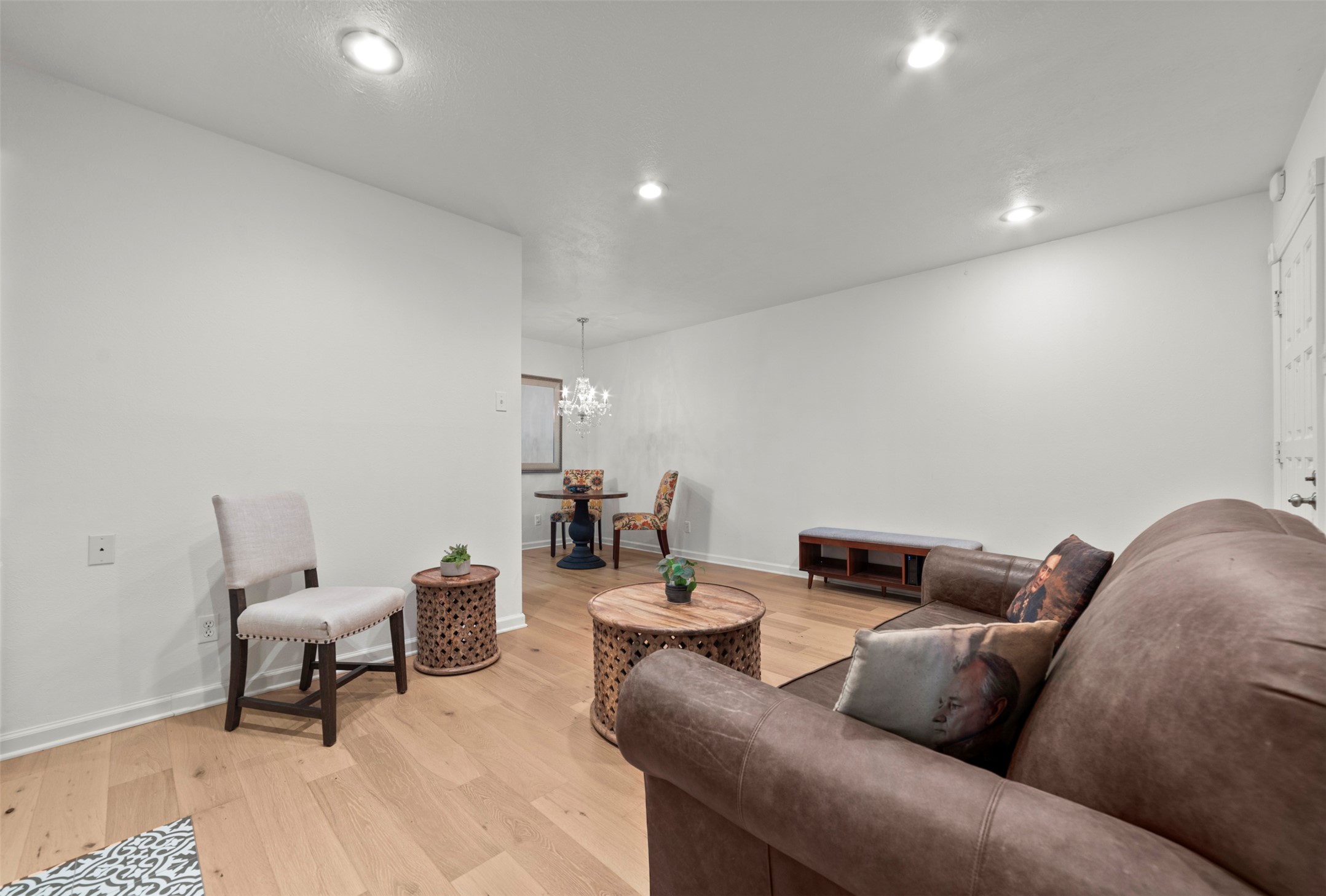 505 West 7th Street, Unit 113 Austin, TX 78701 - Photo 7 of 26 a living room with furniture and a rug