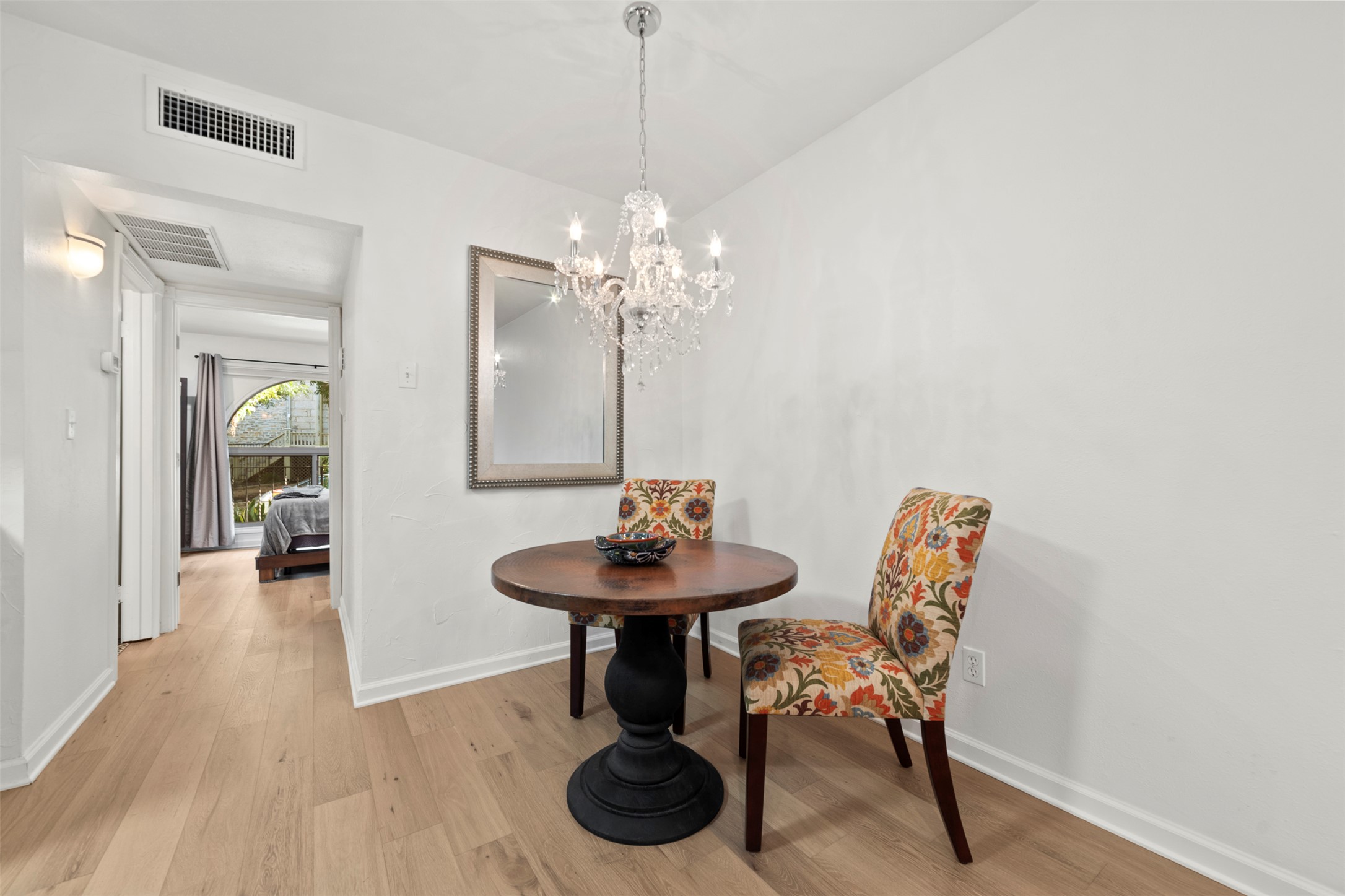 505 West 7th Street, Unit 113 Austin, TX 78701 - Photo 9 of 26 a dining room with furniture and wooden floor