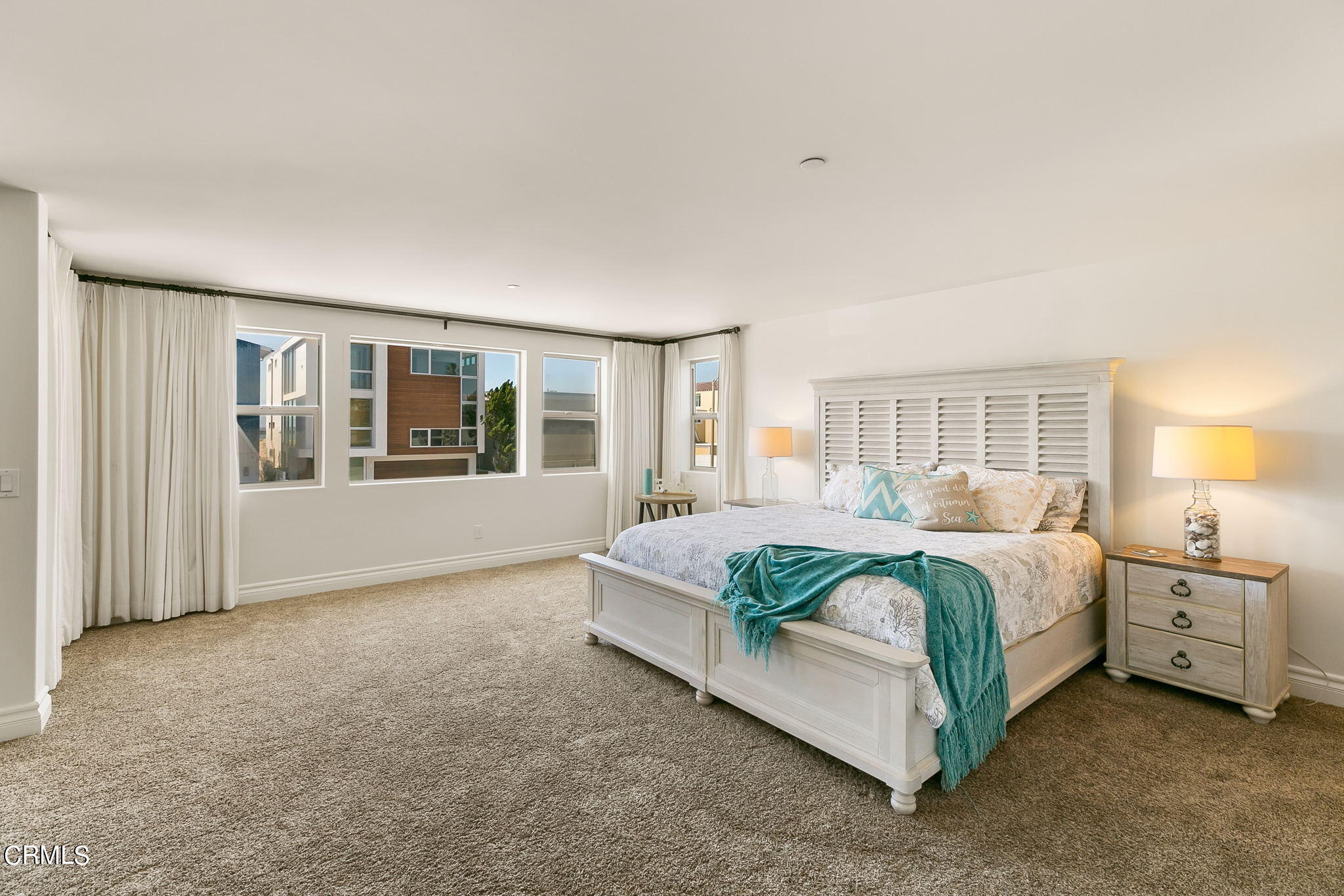 3224 Ocean Drive Oxnard, CA 93035 - Photo 23 of 52 a spacious bedroom with a bed and window