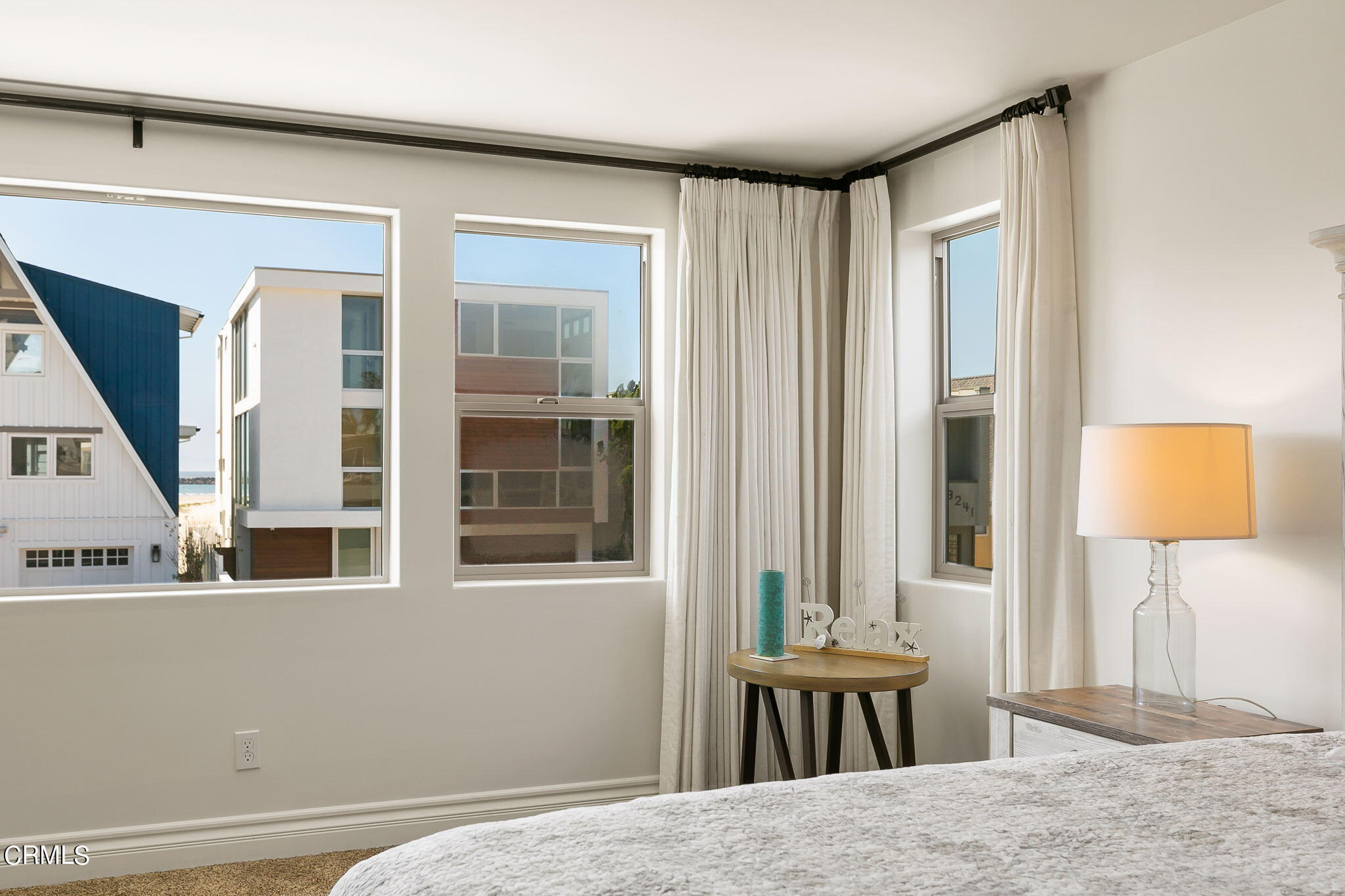 3224 Ocean Drive Oxnard, CA 93035 - Photo 26 of 52 a bedroom with a bed and a window