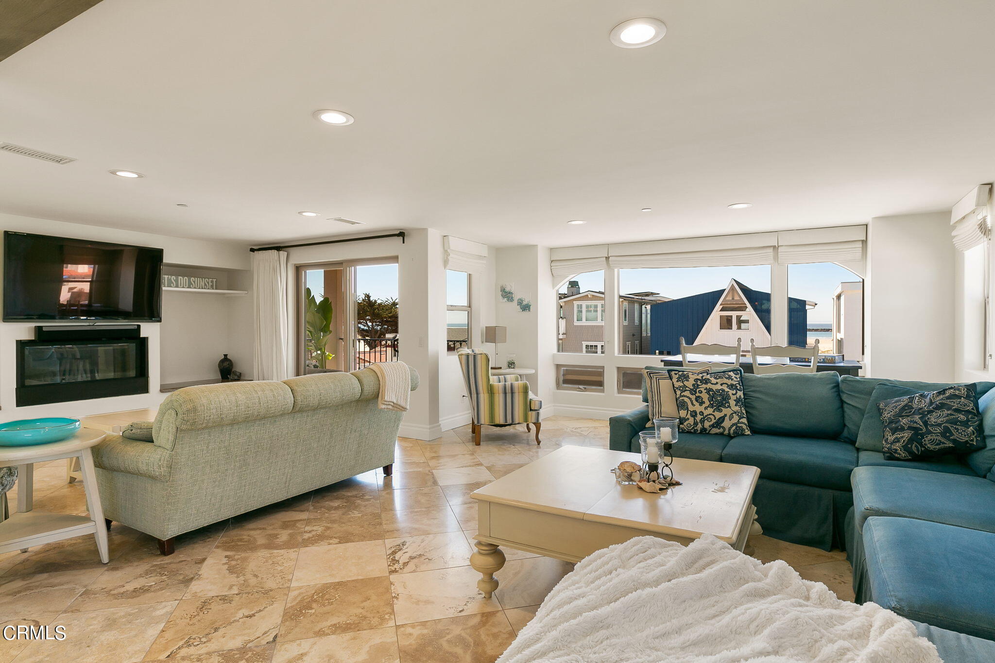 3224 Ocean Drive Oxnard, CA 93035 - Photo 4 of 52 a living room with furniture and a flat screen tv