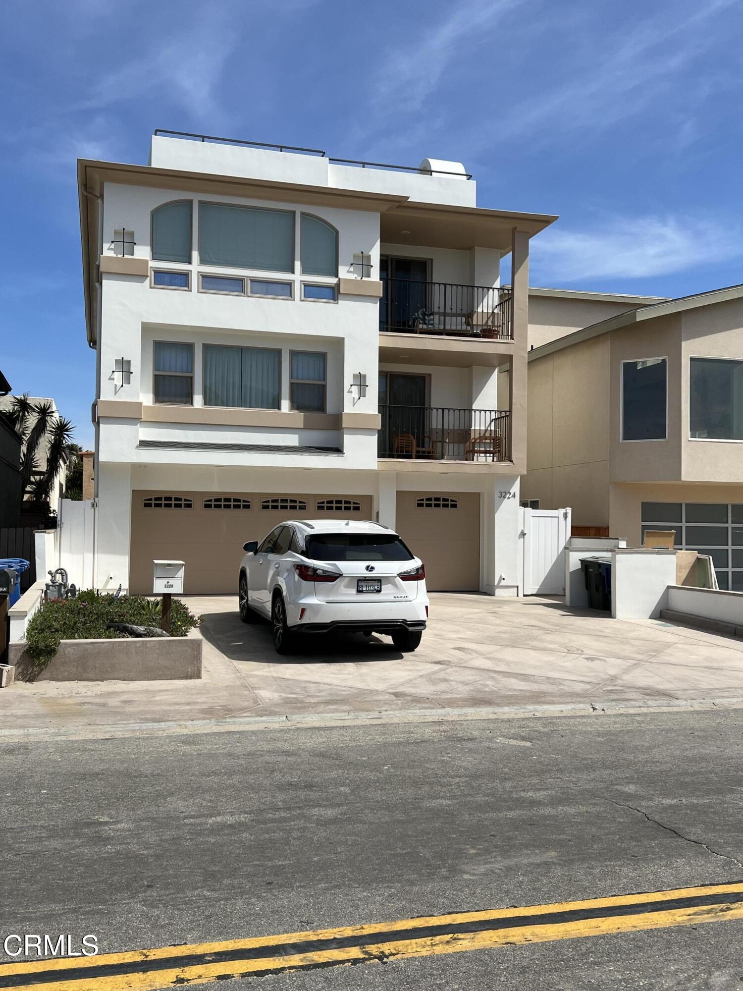 3224 Ocean Drive Oxnard, CA 93035 - Photo 50 of 52 a car parked in front of a house