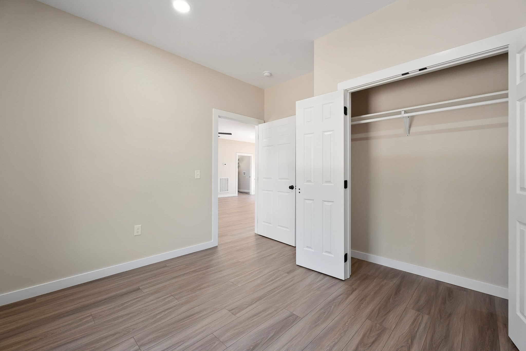 599 Hutchins Bend Road Smithville, TN 37166 - Photo 13 of 36 a view of an empty room with wooden floor