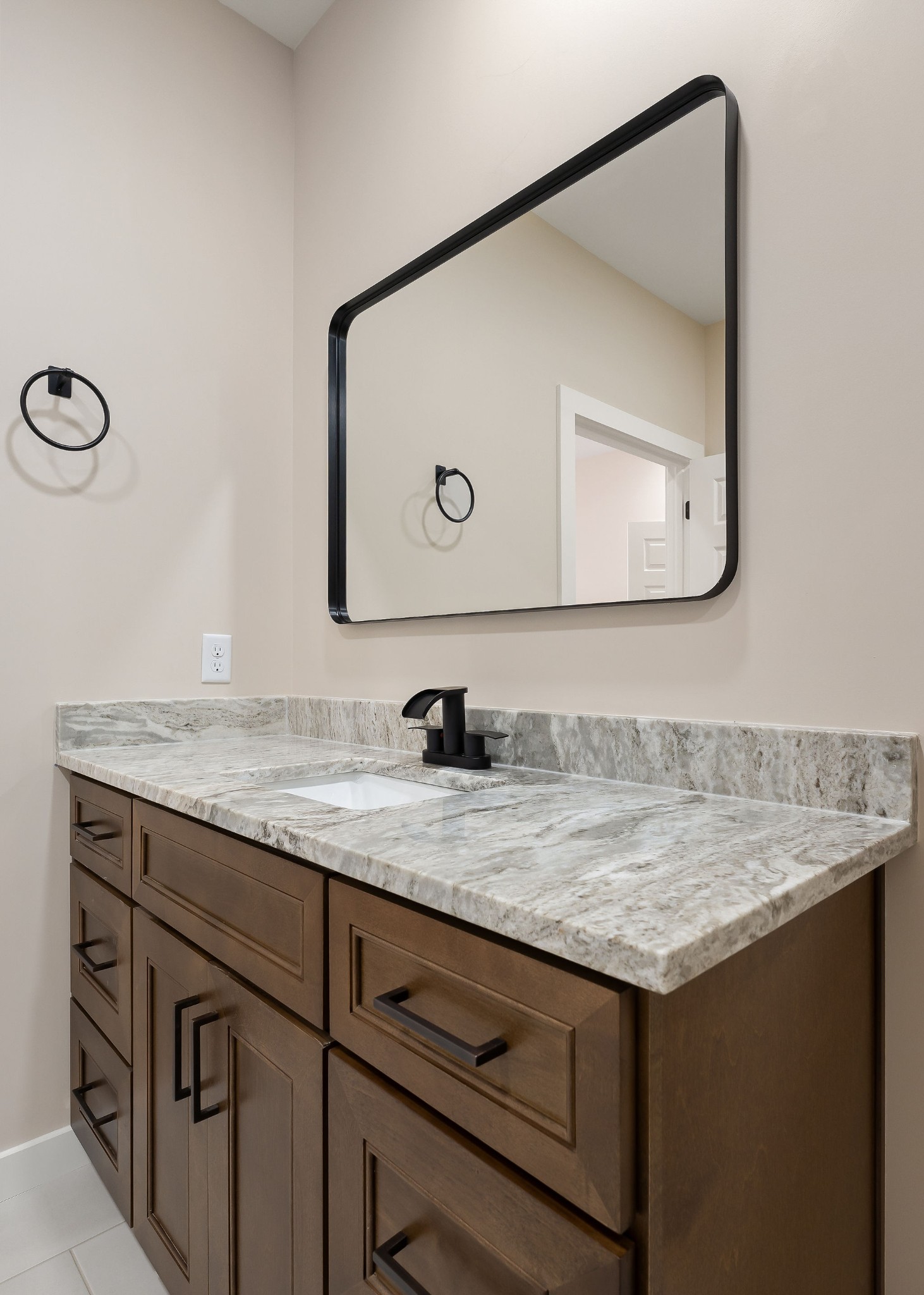 599 Hutchins Bend Road Smithville, TN 37166 - Photo 19 of 36 a bathroom with a granite countertop sink vanity and a mirror