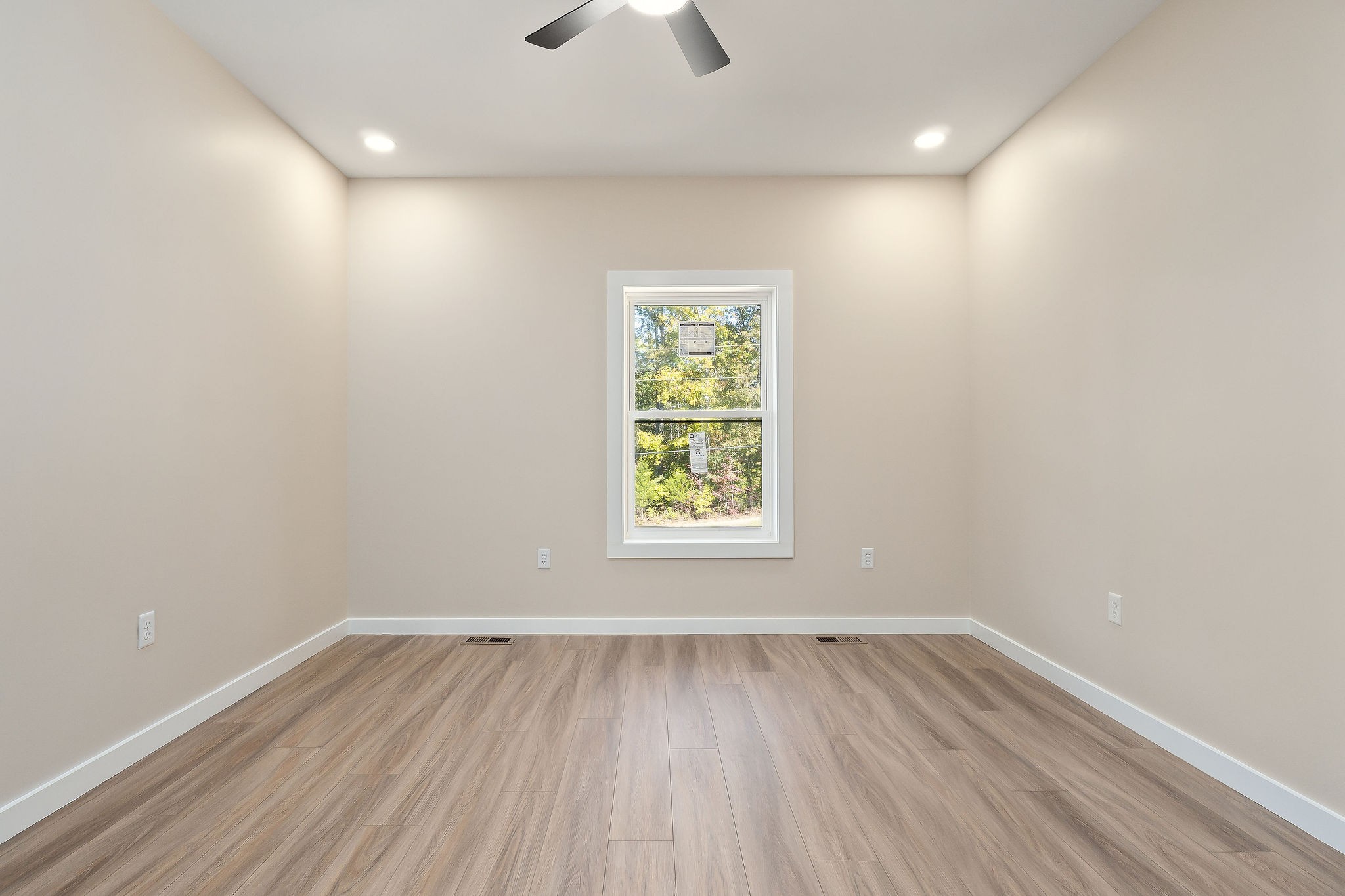 599 Hutchins Bend Road Smithville, TN 37166 - Photo 21 of 36 wooden floor in an empty room with a window