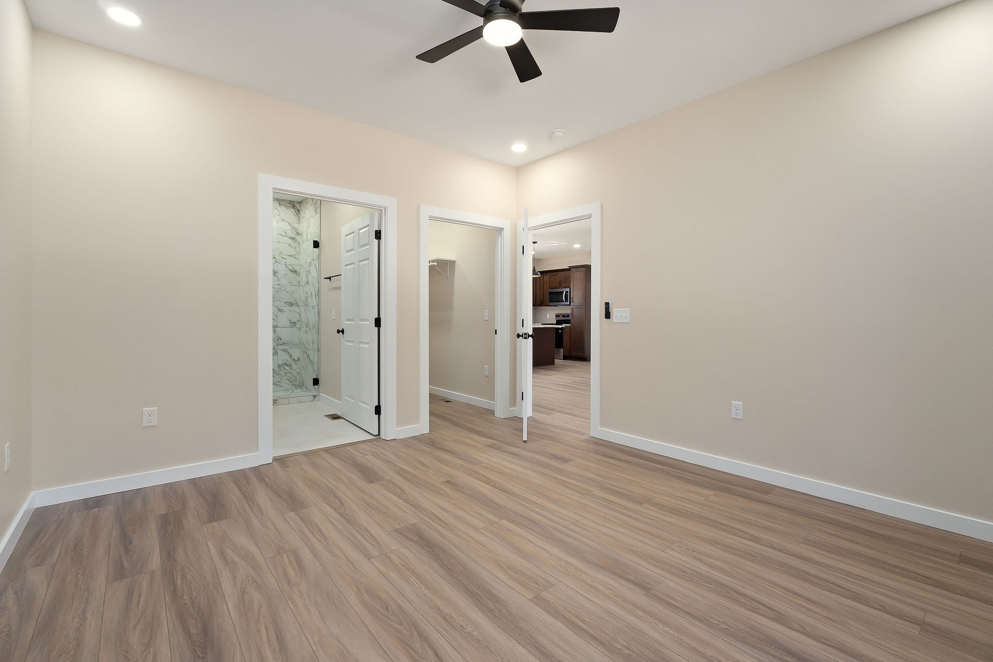 599 Hutchins Bend Road Smithville, TN 37166 - Photo 22 of 36 wooden floor in an empty room with a ceiling fan