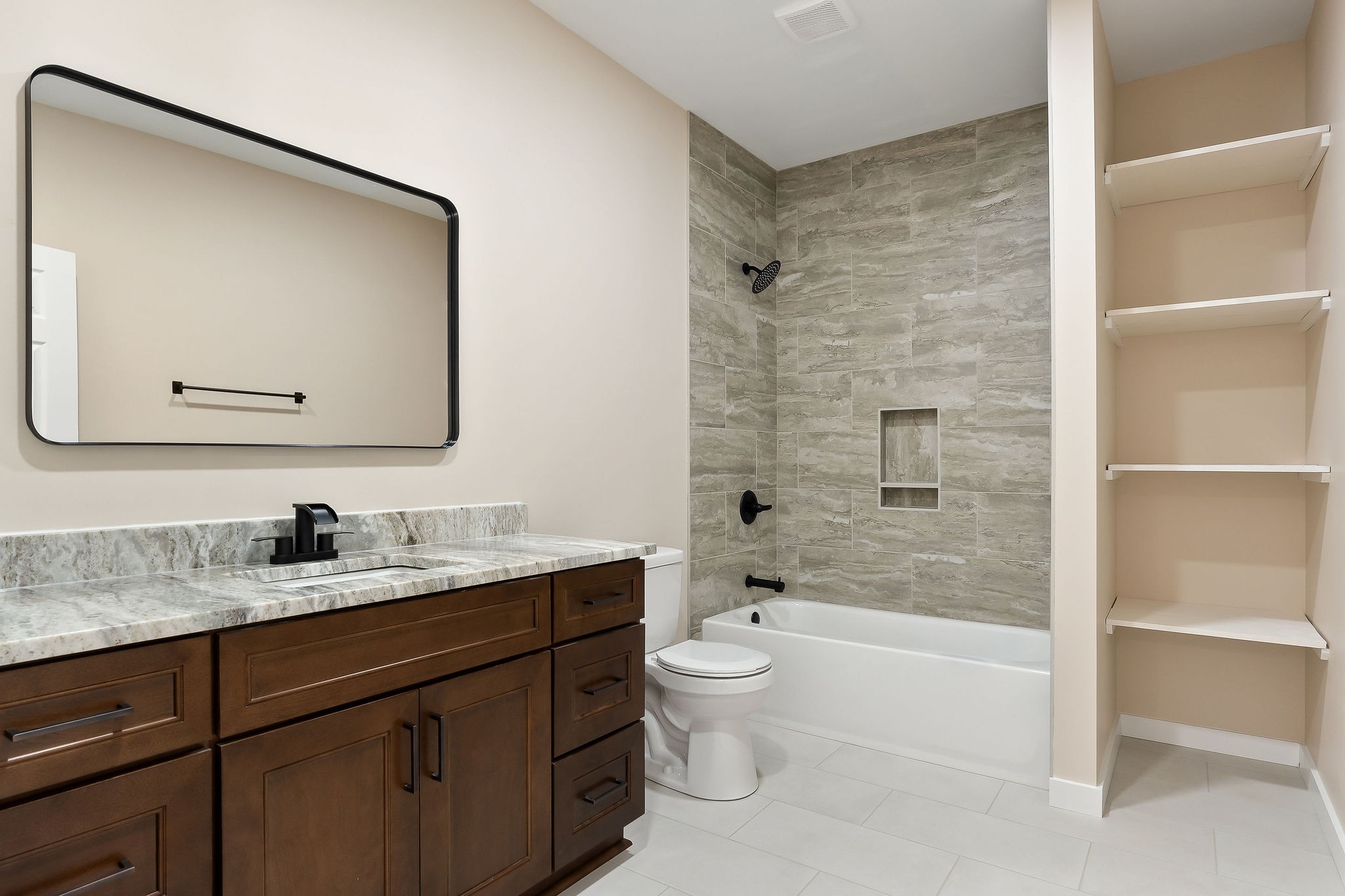 599 Hutchins Bend Road Smithville, TN 37166 - Photo 25 of 36 a bathroom with a double vanity sink toilet mirror and bathtub