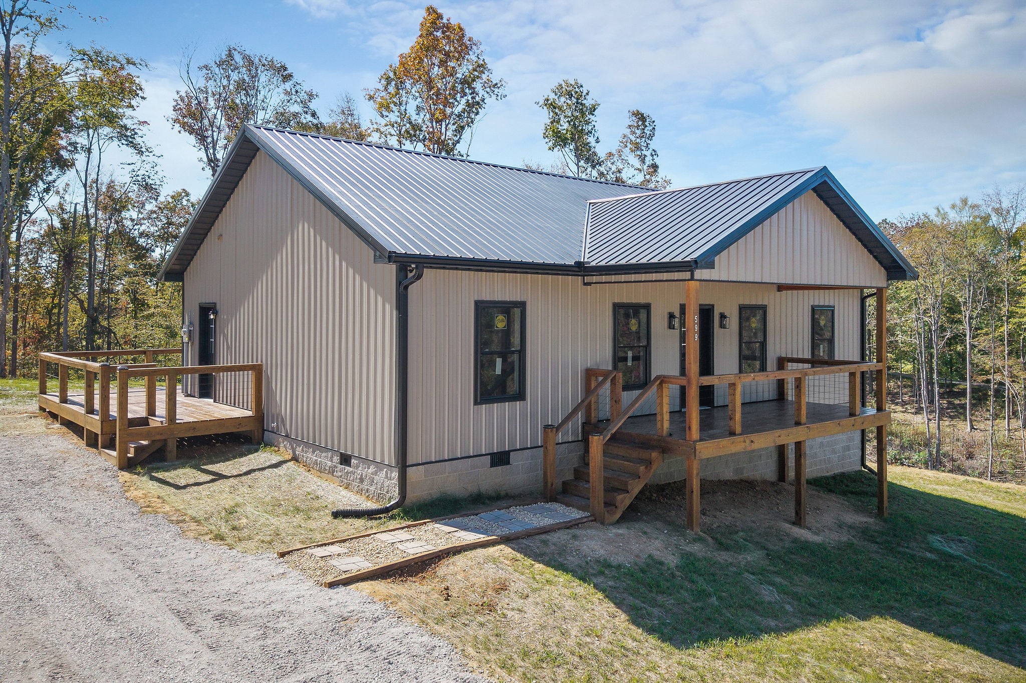 599 Hutchins Bend Road Smithville, TN 37166 - Photo 30 of 36 a view of a house with backyard and sitting area