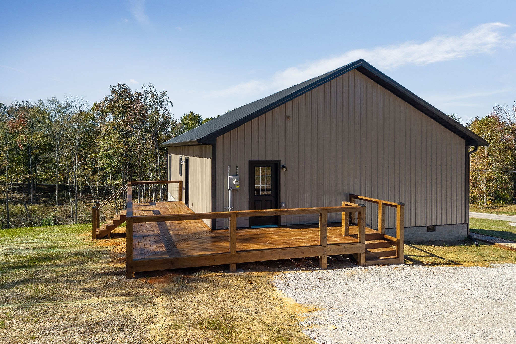 599 Hutchins Bend Road Smithville, TN 37166 - Photo 6 of 36 a backyard of a house with barbeque oven and outdoor seating