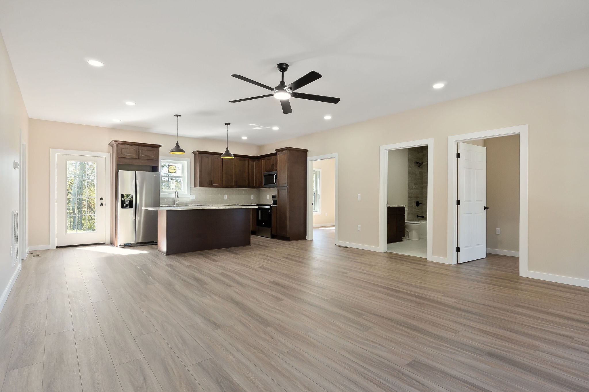 599 Hutchins Bend Road Smithville, TN 37166 - Photo 9 of 36 a view of a kitchen with a sink and a refrigerator