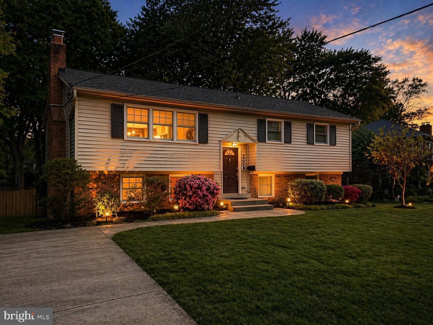 2003 Rampart Drive Alexandria, VA 22308 - Photo 2 of 38 a front view of house with yard and green space