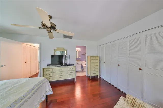 a view of a livingroom with furniture and hardwood floor