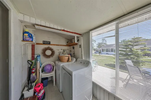 a front view of a house with a garden and yard