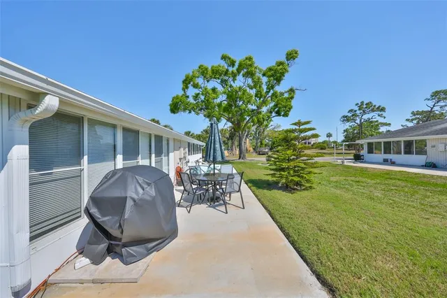 an aerial view of a house with a lake view