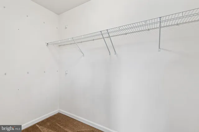 a bathroom with a granite countertop sink a mirror and a bathtub