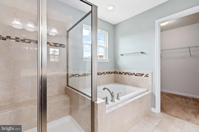 a bathroom with a sink a light fixture and a mirror