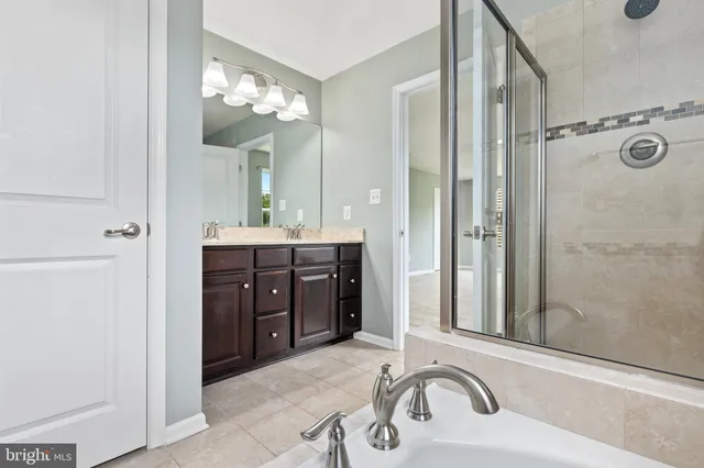 a view of an empty room with a fireplace