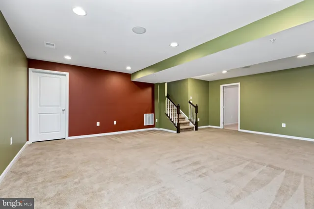a view of an empty room with potted plants