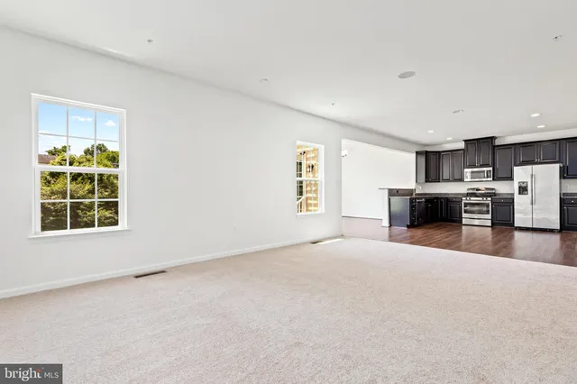 a view of a kitchen with furniture and a window