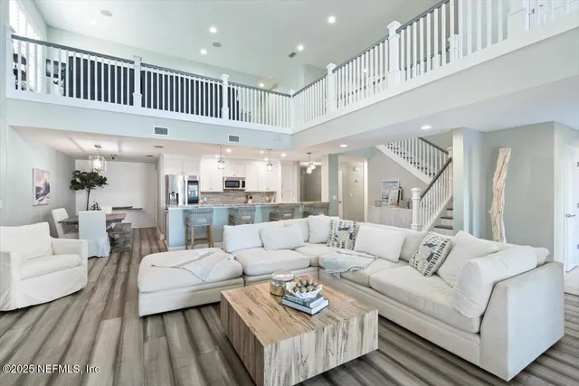 a spacious bedroom with a bed and a flat screen tv