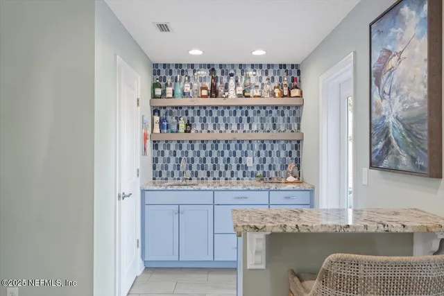 a bathroom with a tub a sink and a mirror