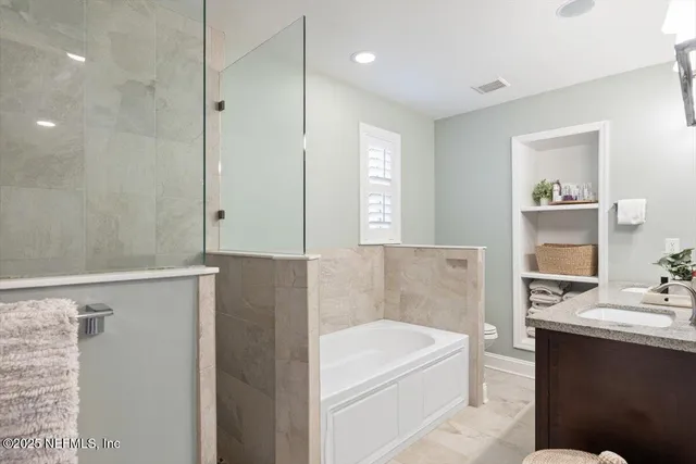 a view of entryway bedroom and hall with wooden floor