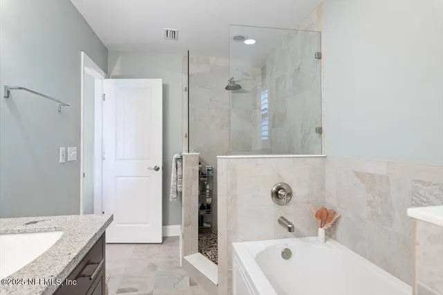 a view of a living room with a flat screen tv