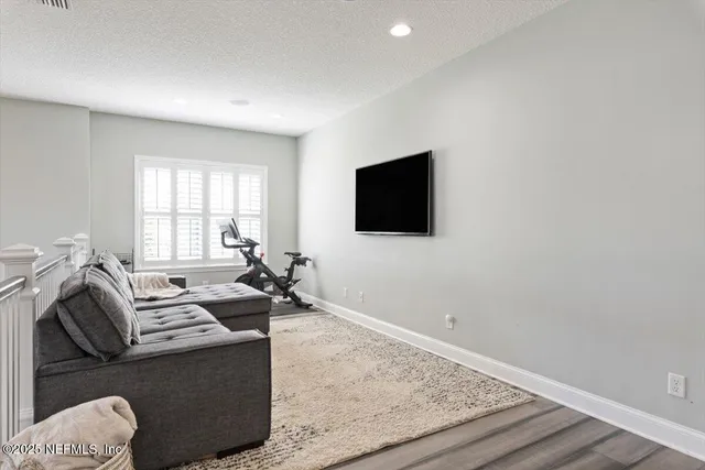 a bathroom with a granite countertop double vanity sink and a mirror