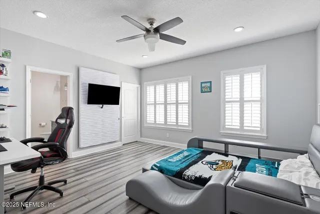 a view of a house with backyard porch and sitting area