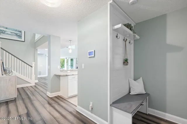 a large kitchen with kitchen island granite countertop a sink and a stove top oven