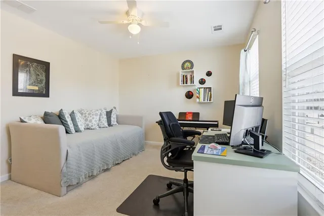 a bedroom with a workspace