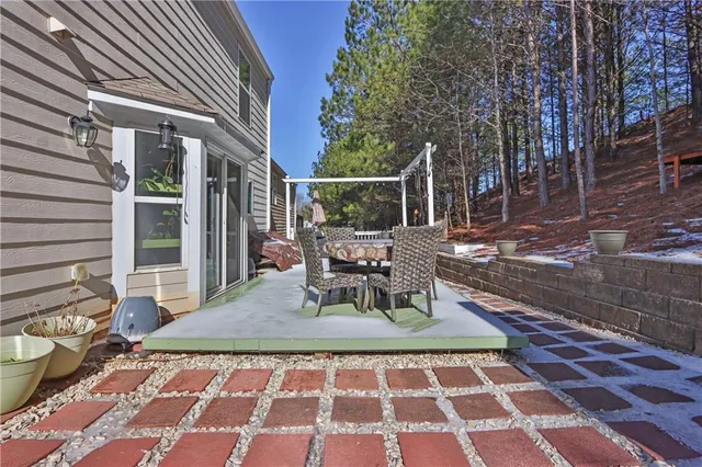 a view of a dinning table and chair in the patio