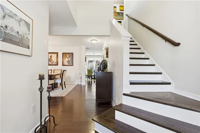 a view of entryway and hall with wooden floor